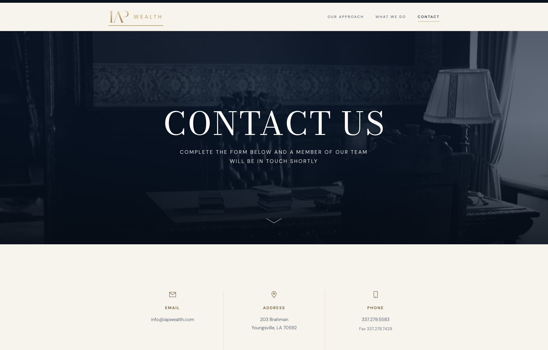The Contact page: a dark interior photograph behind the page title, above email, address, and telephone details set in three columns.